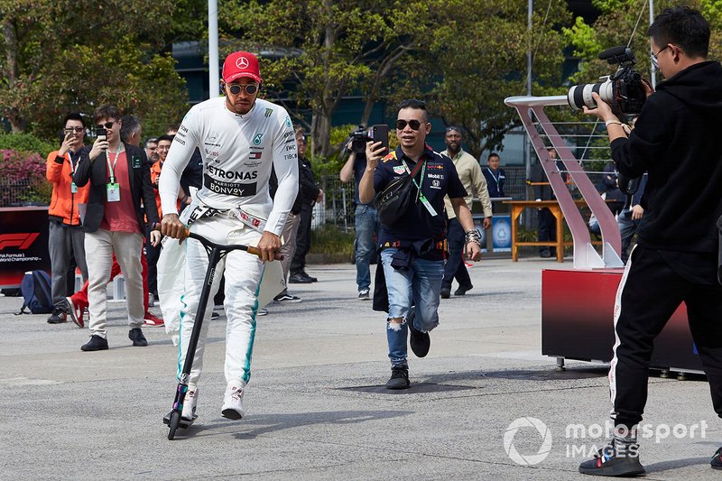 Lewis Hamilton, Mercedes AMG F1, on his scooter