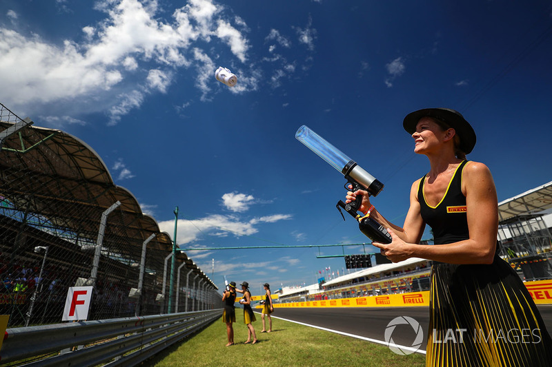 Grid girl fires a T-Shirt into the crowd with a T-Shirt Gun