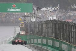 The crashed car of Kimi Raikkonen, Ferrari SF16-H, causes a stoppage