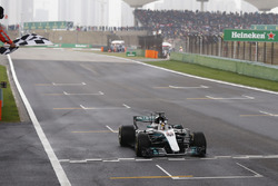 Lewis Hamilton, Mercedes AMG F1 W08, takes the chequered flag at the finish