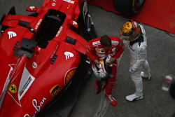 Lewis Hamilton, Mercedes AMG, and Sebastian Vettel, Ferrari, celebrate in parc ferme