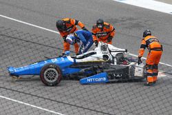 Scott Dixon, Chip Ganassi Racing Honda, gets out the car after a huge crash