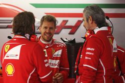 Sebastian Vettel, Ferrari, talks to Maurizio Arrivabene, Team Principal, Ferrari and a team mate