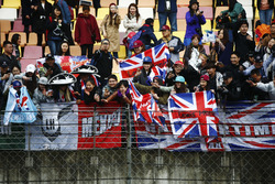 Excited fans receive signed caps from Lewis Hamilton, Mercedes AMG, during a cancelled FP2 session