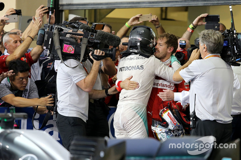 Second place and new world champion Nico Rosberg, Mercedes AMG F1 and Sebastian Vettel, Scuderia Ferrari