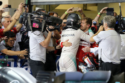Second place and new world champion Nico Rosberg, Mercedes AMG F1 and Sebastian Vettel, Scuderia Ferrari