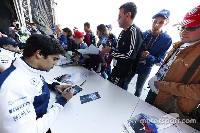 Lance Stroll, Williams, signs autographs for fans, alongside Felipe Massa, Williams