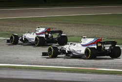Felipe Massa, Williams FW40, passes the stopped car of team mate Lance Stroll, Williams FW40