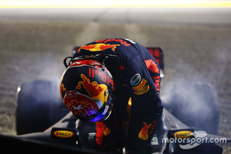 Max Verstappen, Red Bull Racing RB13, climbs from his car after retiring from the race