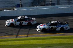 Brad Keselowski, Team Penske Ford Fusion and David Gilliland, RBR Enterprises Ford Fusion