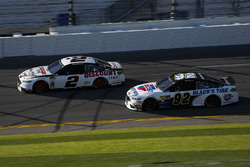 Brad Keselowski, Team Penske Ford Fusion and David Gilliland, RBR Enterprises Ford Fusion