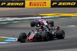 Romain Grosjean, Haas F1 Team VF-18, leads Sergio Perez, Force India VJM11