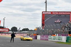 #63 Corvette Racing Chevrolet Corvette C7.R: Jan Magnussen, Antonio Garcia, Mike Rockenfeller crosses the finish line with checkered flag