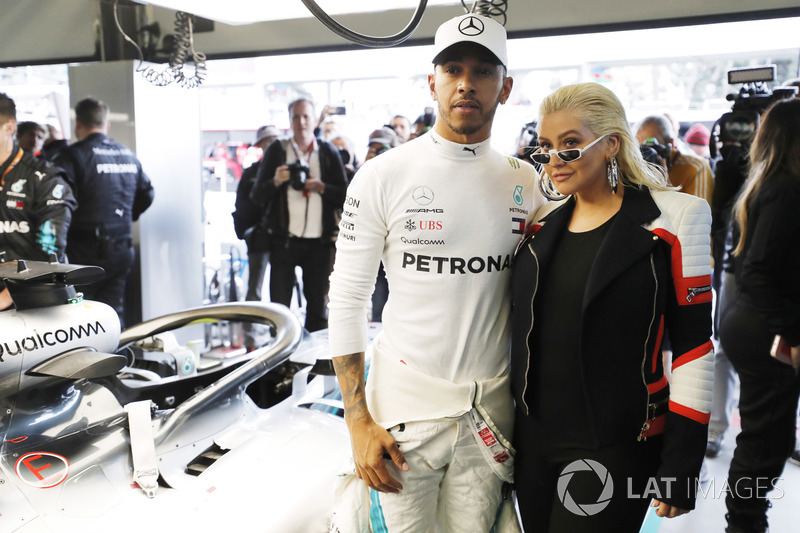 Lewis Hamilton, Mercedes AMG F1, in the garage with singer Christina Aguilera