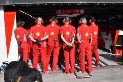 Ferrari mechanics cover the garage