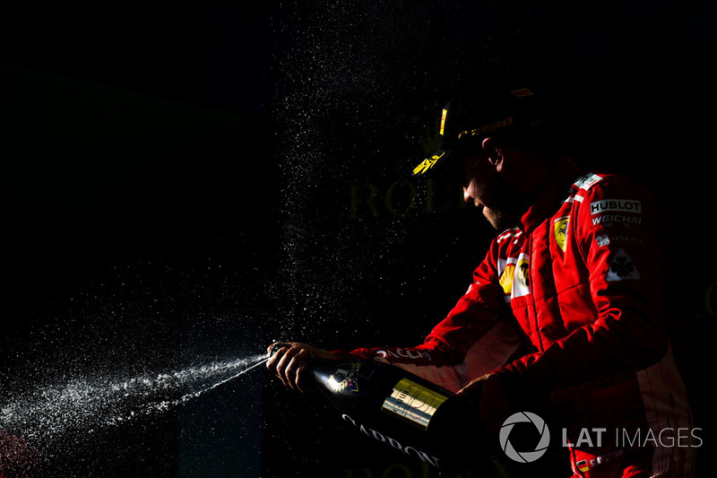 Race winner Sebastian Vettel, Ferrari celebrates on the podium with the champagne