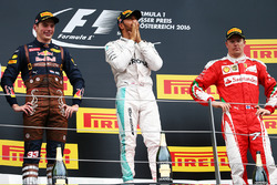 Race winner Lewis Hamilton, Mercedes AMG F1 celebrates on the podium with second place Max Verstappe
