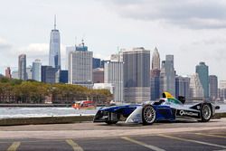 A Formula E car with the New York City skyline