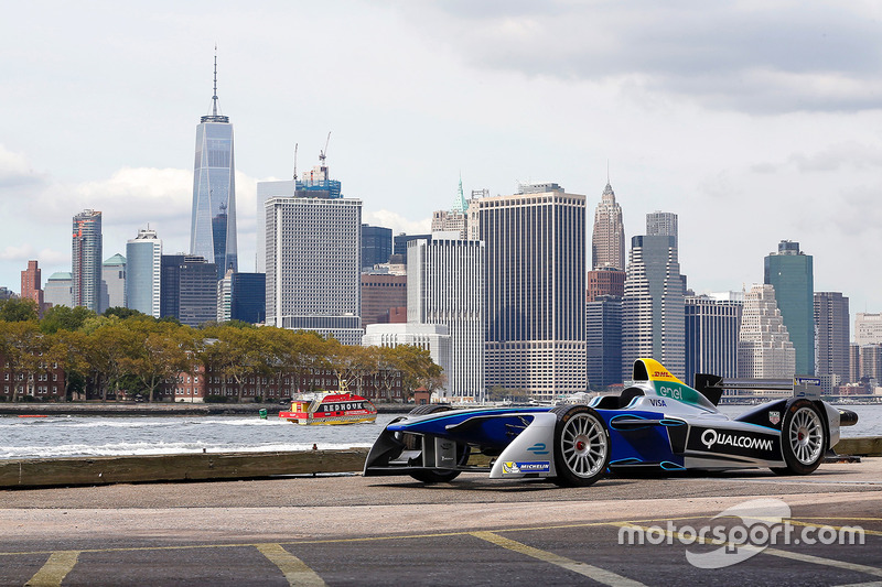 A Formula E car with the New York City skyline