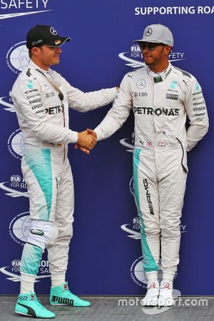 Nico Rosberg, Mercedes AMG F1 celebrates his pole position in parc ferme with second placed team mate Lewis Hamilton, Mercedes AMG F1