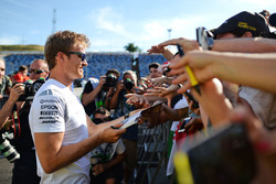 Nico Rosberg, Mercedes AMG F1 signs autographs for the fans