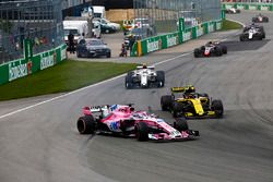 A sideways Sergio Perez, Force India VJM11, battles with Carlos Sainz Jr., Renault Sport F1 Team R.S