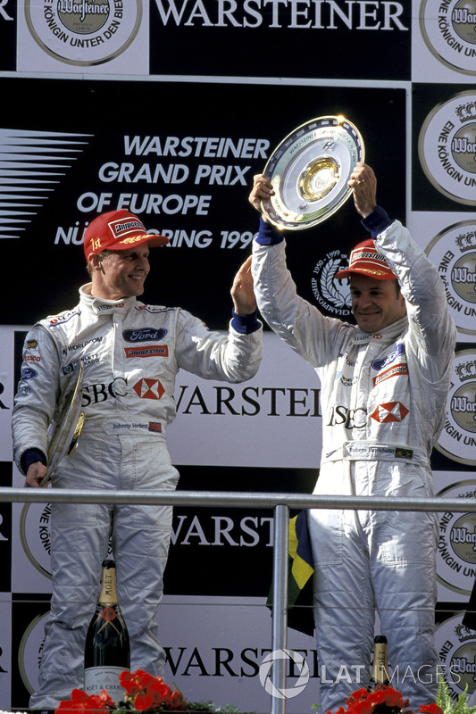 Podium: race winner Johhny Herbert, second place Rubens Barrichello, celebrate on the podium