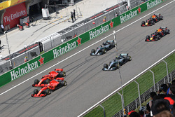 Sebastian Vettel, Ferrari SF71H and Kimi Raikkonen, Ferrari SF71H lead at the start of the race