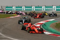 Sebastian Vettel, Ferrari SF71H leads at the start of the race