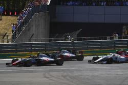 Kevin Magnussen, Haas F1 Team VF-18, leads Romain Grosjean, Haas F1 Team VF-18, and Charles Leclerc, Sauber C37