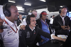 Toto Wolff, Executive Director (Business), Mercedes AMG, Niki Lauda, Non-Executive Chairman, Mercedes AMG, Dr Dieter Zetsche, CEO, Mercedes Benz, and others celebrate after their drivers secure the front row