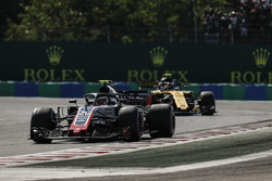 Kevin Magnussen, Haas F1 Team VF-18, leads Carlos Sainz Jr., Renault Sport F1 Team R.S. 18