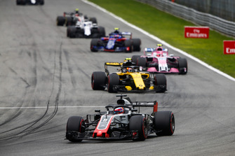Romain Grosjean, Haas F1 Team VF-18, leads Carlos Sainz Jr., Renault Sport F1 Team RS 18, Esteban Ocon, Racing Point Force India VJM11, and Pierre Gasly, Toro Rosso STR13
