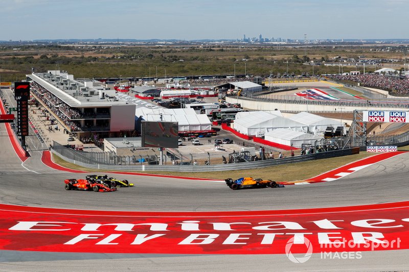 Lando Norris, McLaren MCL34, leads Daniel Ricciardo, Renault R.S.19 and Sebastian Vettel, Ferrari SF90 