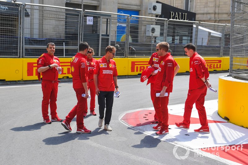 Sebastian Vettel, Ferrari walks the track with his engineers