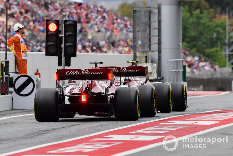 Antonio Giovinazzi, Alfa Romeo Racing C38, leads Kimi Raikkonen, Alfa Romeo Racing C38, in the pit lane