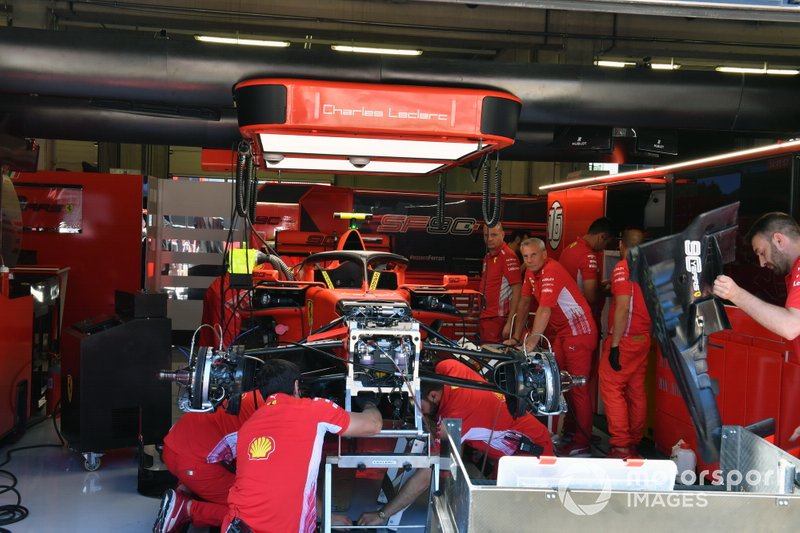 The Ferrari mechanics build the car for Charles Leclerc, Ferrari SF90, in the garage