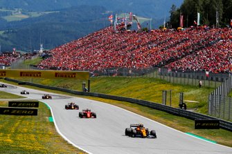 Lando Norris, McLaren MCL34, leads Sebastian Vettel, Ferrari SF90, Max Verstappen, Red Bull Racing RB15, and Pierre Gasly, Red Bull Racing RB15