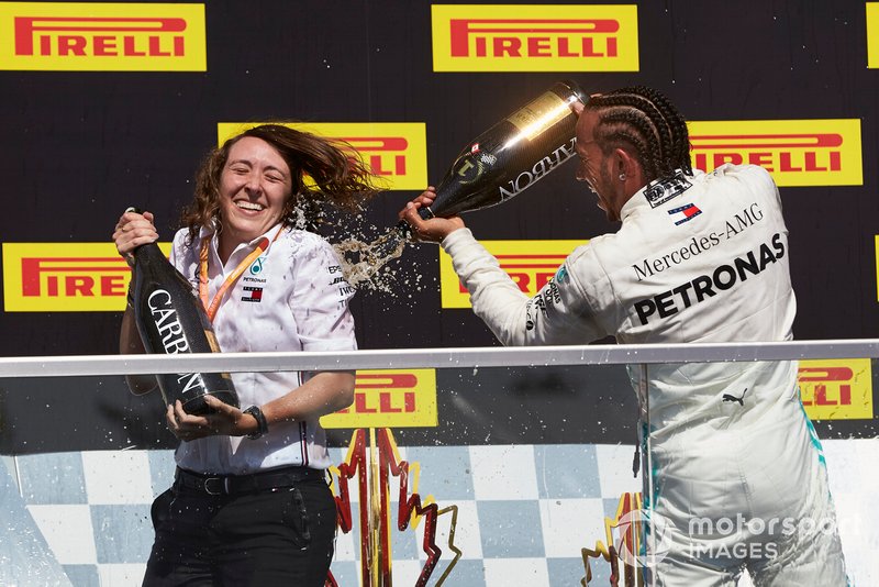 Lewis Hamilton, Mercedes AMG F1, 1st position, sprays Champagne on his team mate on the podium