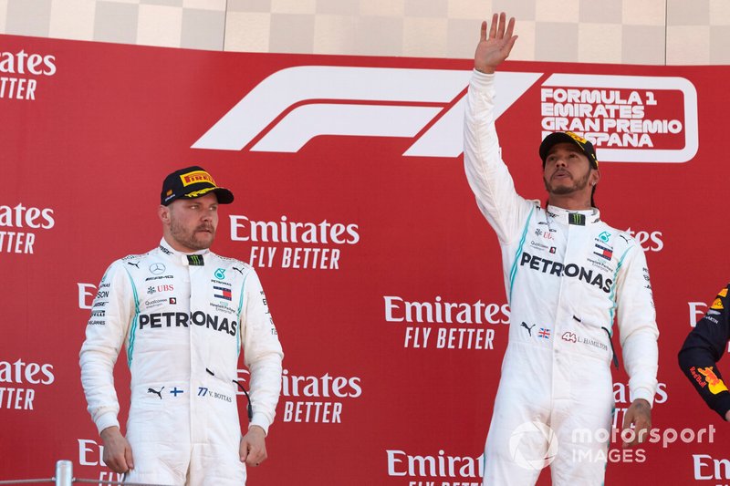 Valtteri Bottas, Mercedes AMG F1, 2nd position, and Lewis Hamilton, Mercedes AMG F1, 1st position, celebrate on the podium