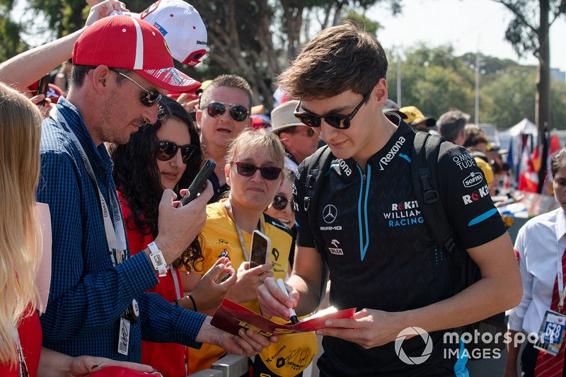 George Russell, Williams Racing, signs autographs for fans
