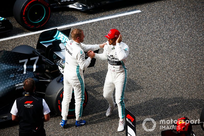 Lewis Hamilton, Mercedes AMG F1, congratulates team mate Valtteri Bottas, Mercedes AMG F1, on pole position