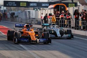 Carlos Sainz Jr, McLaren MCL34 and Valtteri Bottas, Mercedes-AMG F1 W10 EQ Power+