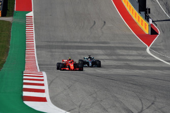 Kimi Raikkonen, Ferrari SF71H leads Lewis Hamilton, Mercedes AMG F1 W09 EQ Power+