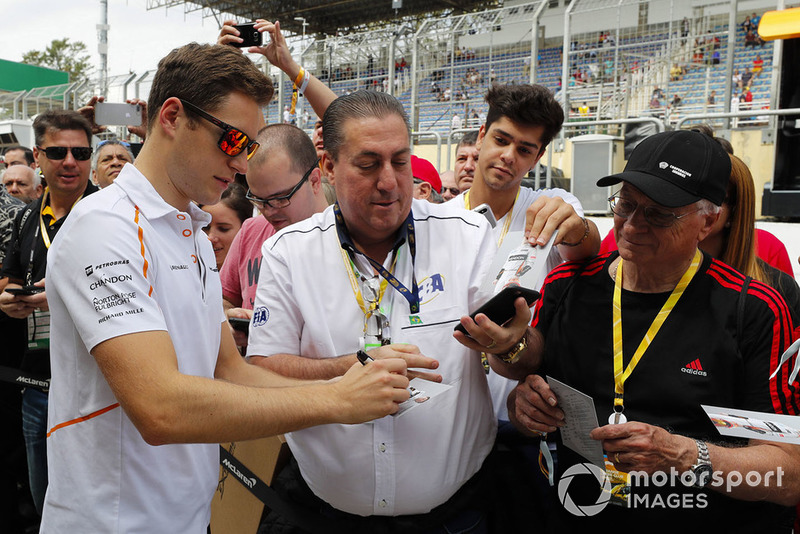 Stoffel Vandoorne, McLaren, signs autographs for fans