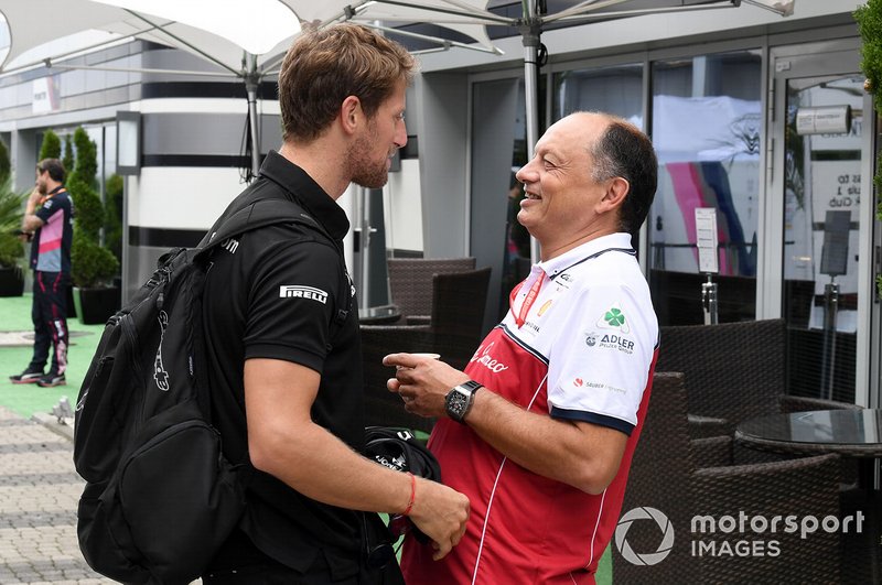 Romain Grosjean, Haas F1 speaks with Frederic Vasseur, Team Principal, Alfa Romeo Racing