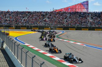 Lewis Hamilton, Mercedes AMG F1 W10, leads Carlos Sainz Jr., McLaren MCL34, Valtteri Bottas, Mercedes AMG W10, Lando Norris, McLaren MCL34, Sergio Perez, Racing Point RP19, and the remainder of the field at the start