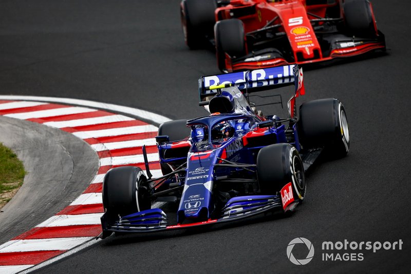 Alexander Albon, Toro Rosso STR14, leads Sebastian Vettel, Ferrari SF90