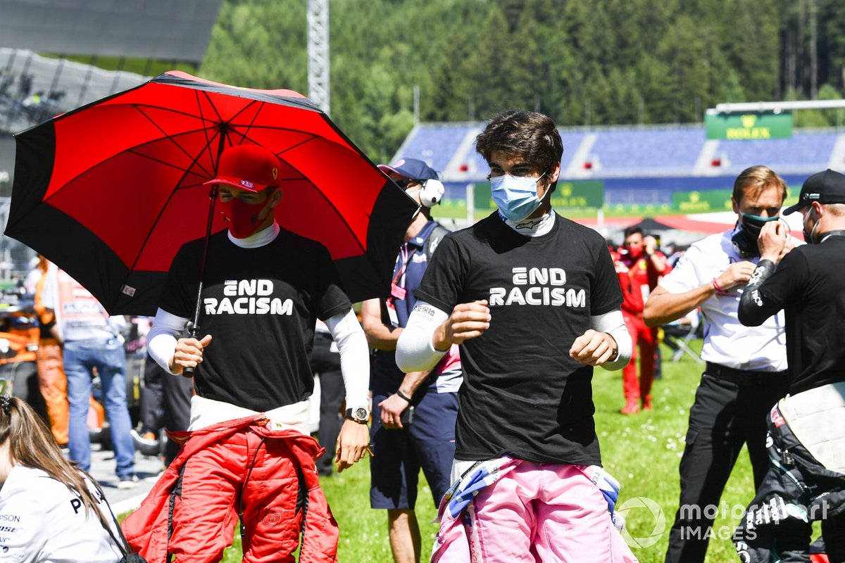 Charles Leclerc, Ferrari, and Lance Stroll, Racing Point, on the grid