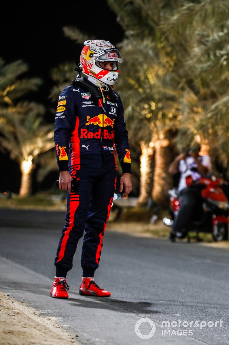 Max Verstappen, Red Bull Racing, stands by the side of the track after retiring